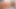 セクシーな女が巨大なペニスが剃った秘部を突き刺す中、快感に喘ぐ