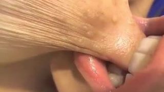 Girl sucking her own nipple