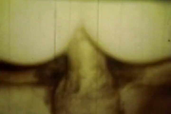 Worn Sepia Loop Captures Curly Retro Couple in Raw Bedroom Passion