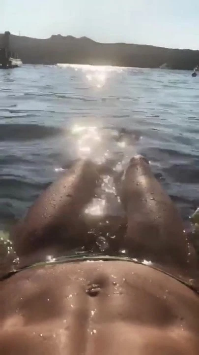 Heidi Klum floating in the water