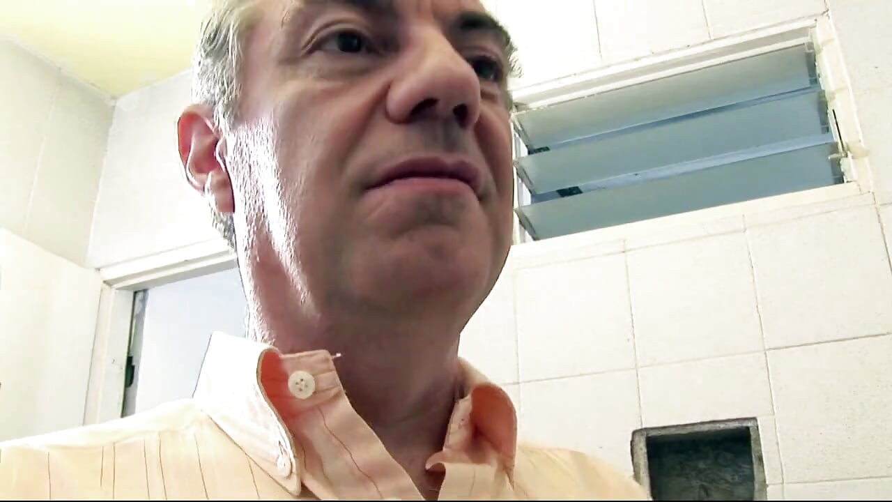 Older dude gets a blowjob in the bathroom by a younger teen