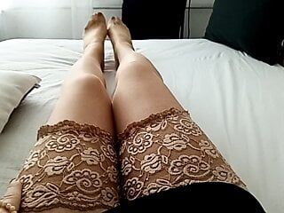 horny MILF tranny in brown lace pantyhose simulates Footjob while playing with vibrator