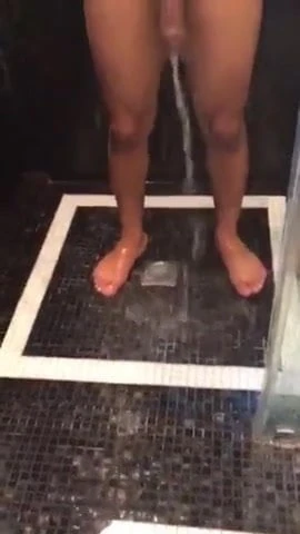 Young guy taking a shower