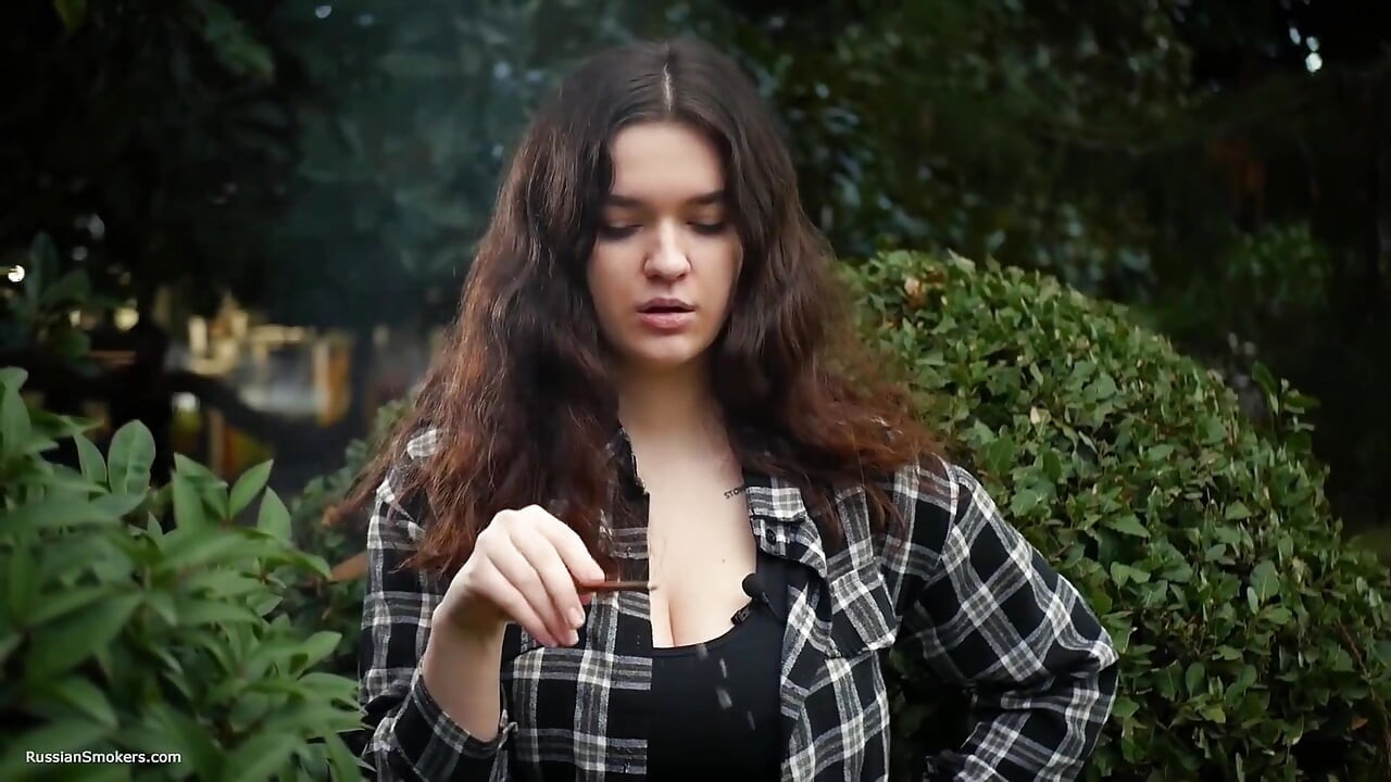 Sweet and Busty Russian Babe Smoking Cigarette in Nature