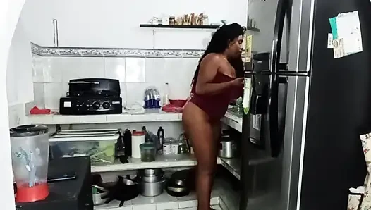 Brunette girl gives cream pie in the kitchen