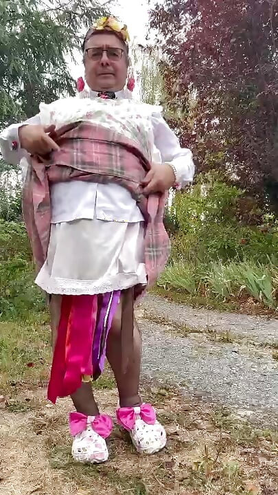In a gardener outfit with a pink dress for a day