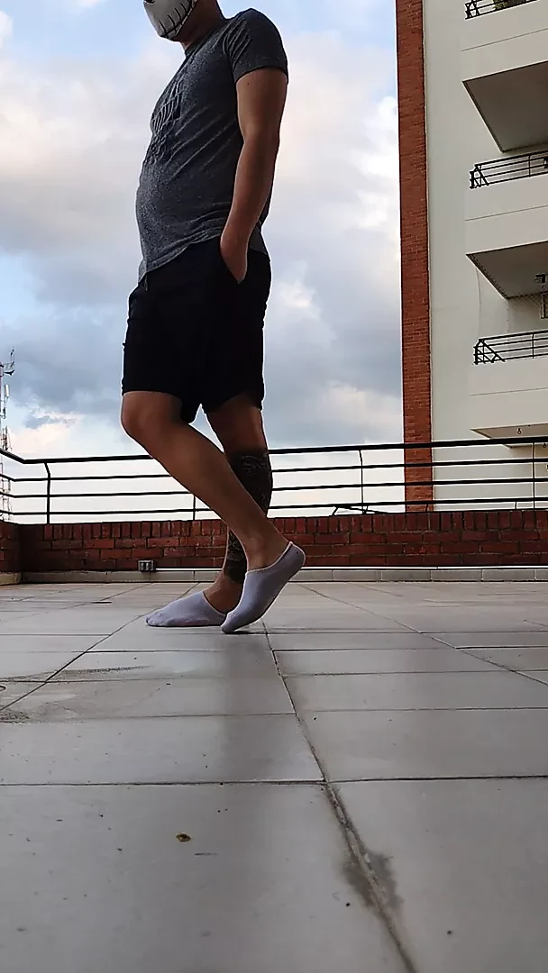 Latino shows his socks OUTDOOR ( Big feet)