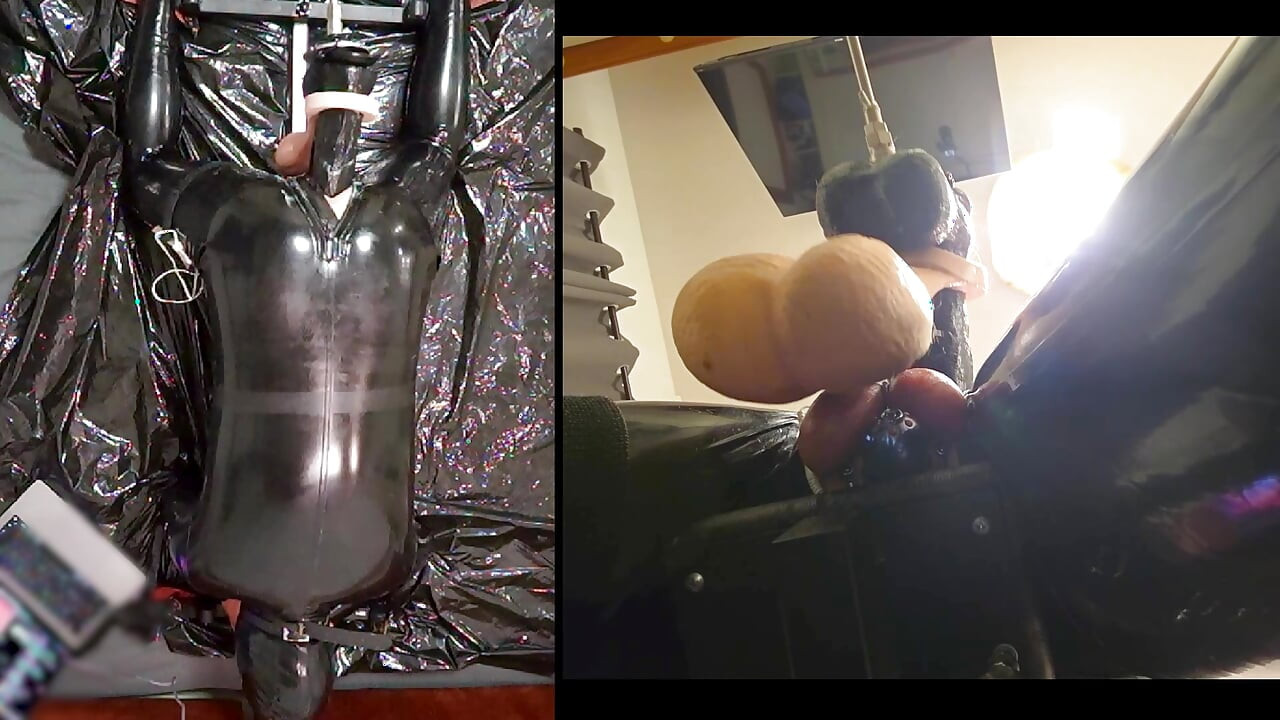 Session in the pillory with Latex Catsuit, PA Chastity, Giant Didildo and Estim