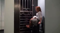 Lady warden disciplines prisoner in her private torture cell