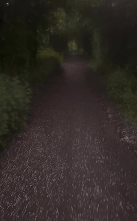 Long naked barefoot walk from car to a welcome to my town sign