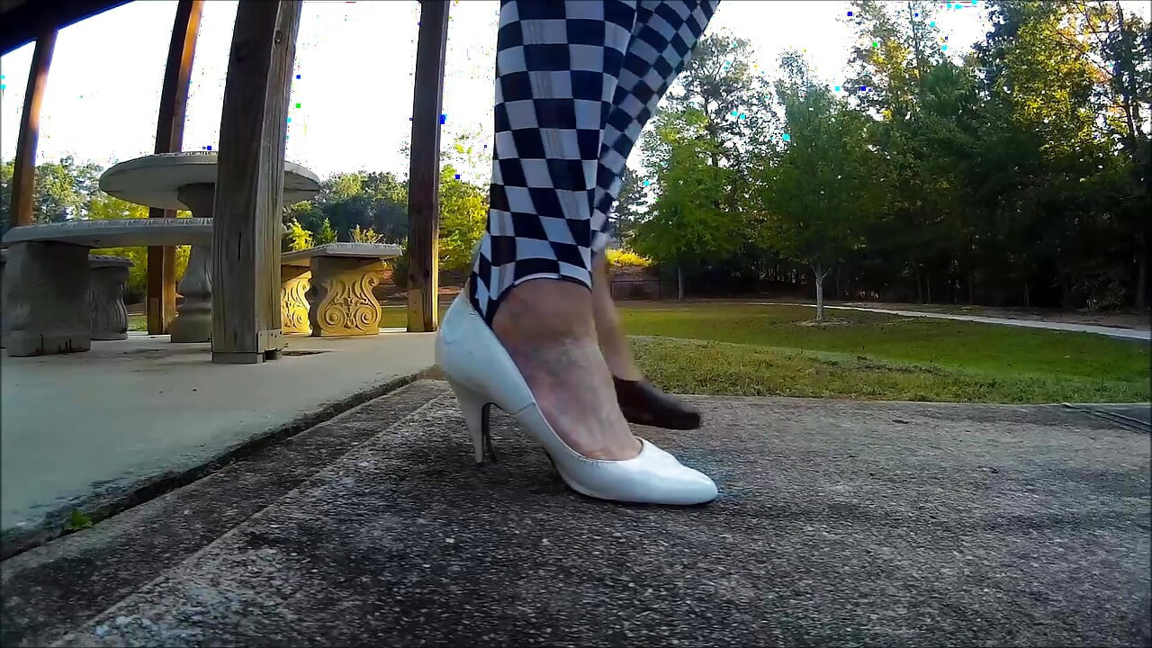 Crossdresser Walking in a public park in high heels