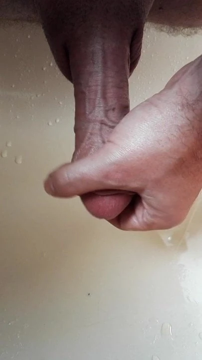 Playing with my pissing cock