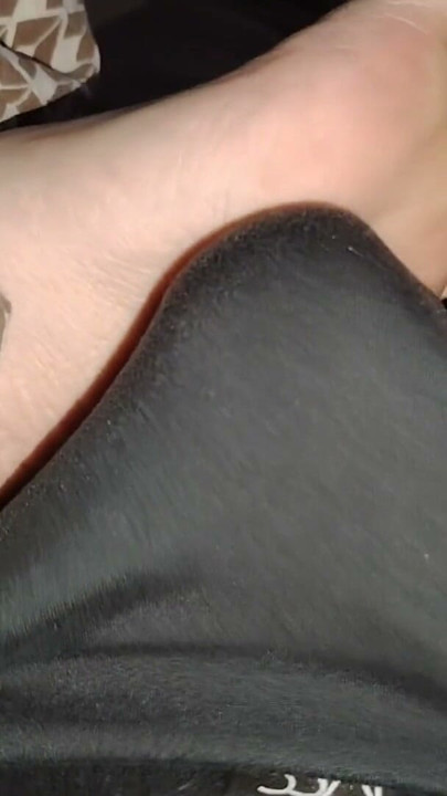 Stepsister's feet get a light massage while watching a movie | Clip 1