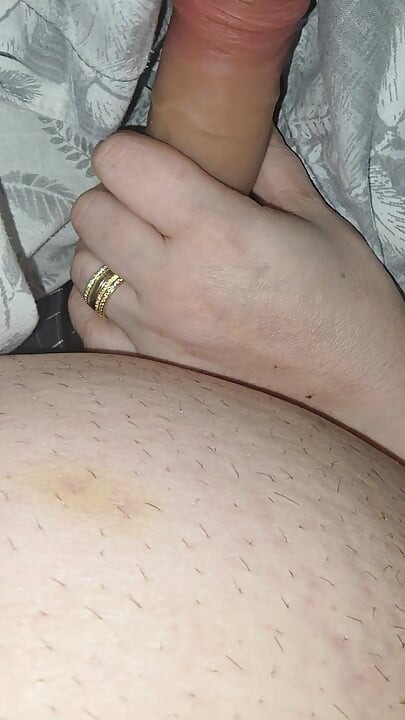 Step sister surprises step brother with a handjob while they watch a movie
