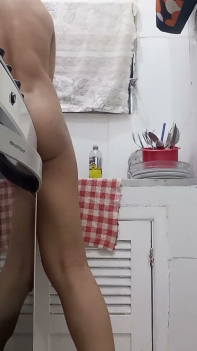 Washing dishes in the naked kitchen | Clip 1