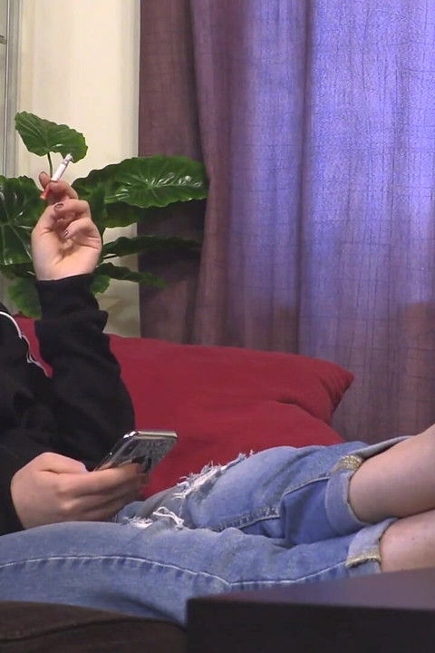 Cute teen in jeans teasin and smoking
