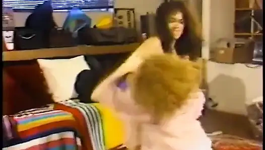 Redhead wrestles with the pretty brunette on the floor