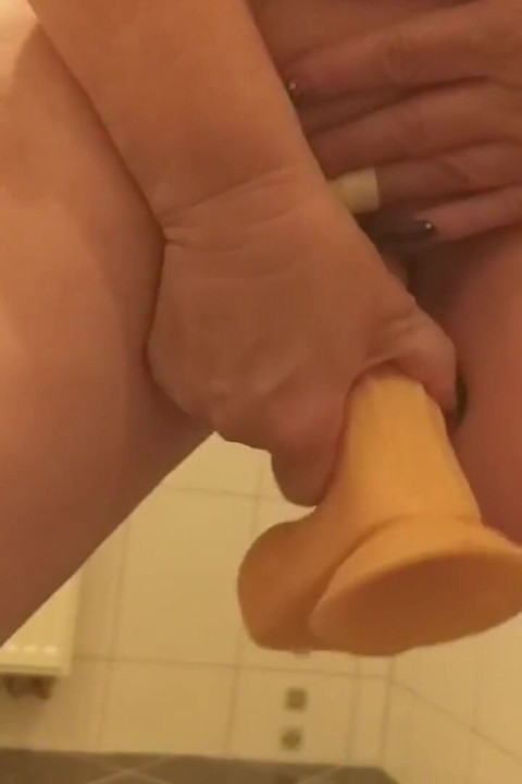 Hot Granny Fucks Her Standing Dildo in the Laundry Room