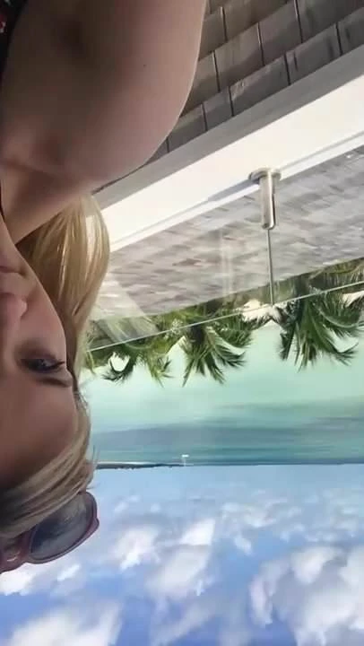 Reese Witherspoon on balcony in bikini top