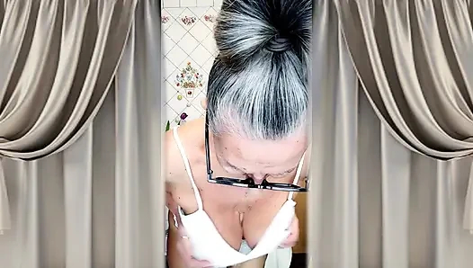 Hot mature housewife Lukerya undresses and teases with her huge tits in the kitchen