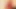 Si rambut merah, gaun merah, dan dildo merah