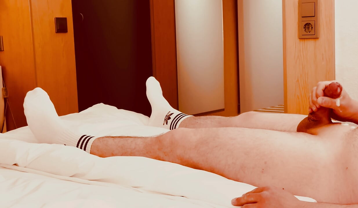 Guy in Adidas tennis socks masturbates until he cums