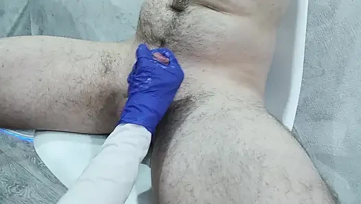 The nurse thoroughly massaged the patient's testicles and penis to collect sperm for analysis.