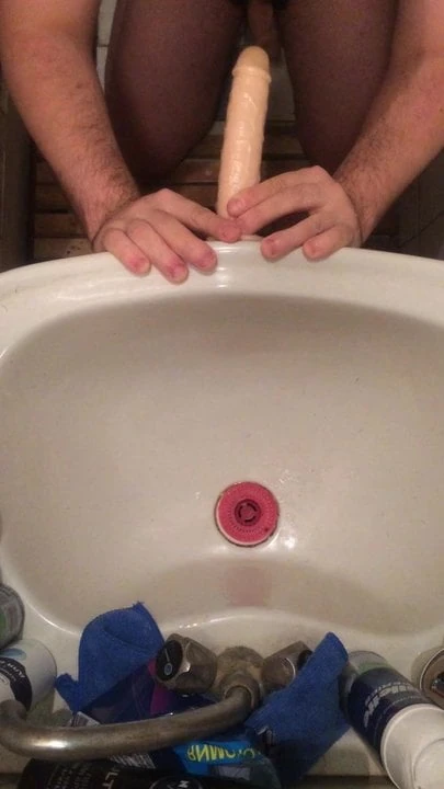 Guy sucking on his knees