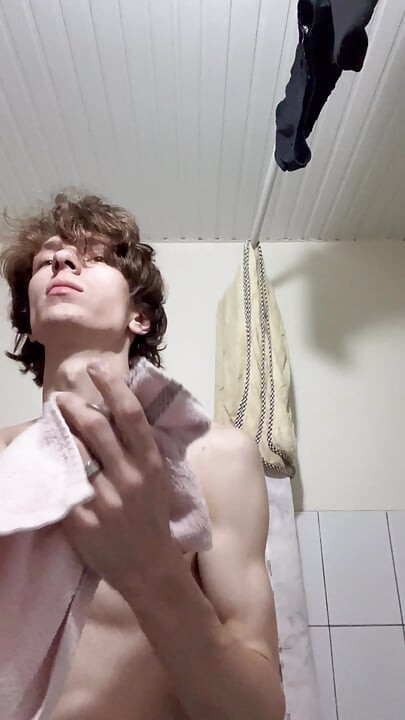 Sexy boy taking a shower