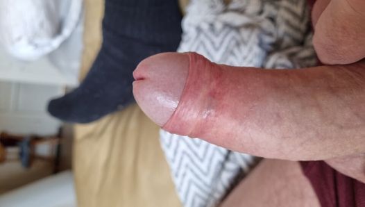 my husband lies and plays with his cock, meaning he rides a dildo