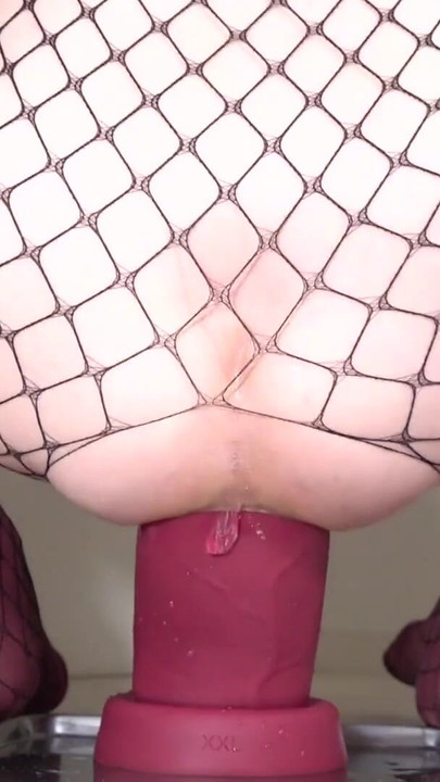 Jaw-dropping moment from "Fishnet Sissy 2025#04 - Riding a Black and Red huge dildo -"
