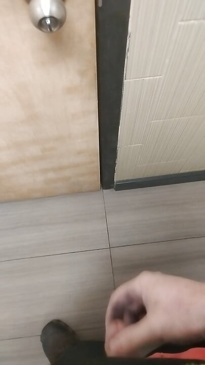 Jerking and cumming in public bathroom hallway