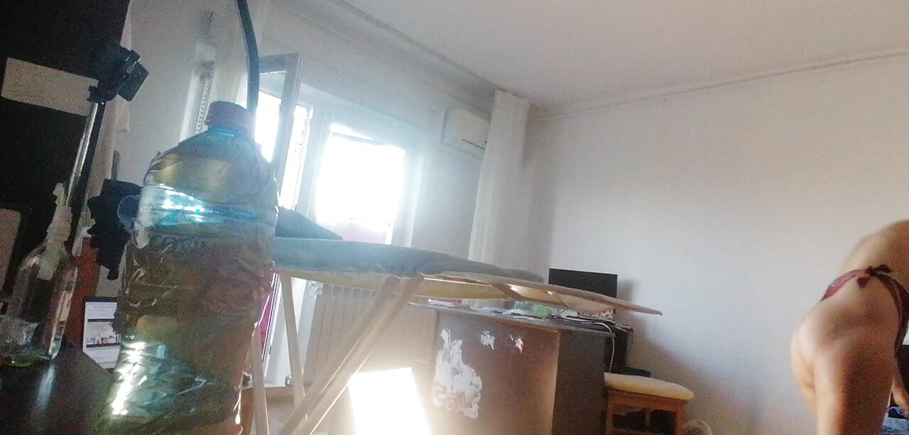 Amateur wife doing housework naked. Sexy and naughty wife trying on clothes that she cuts.