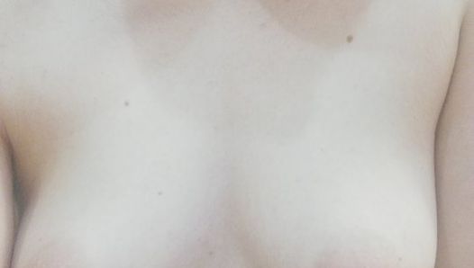 Teen girl rubbing ice on her nipples