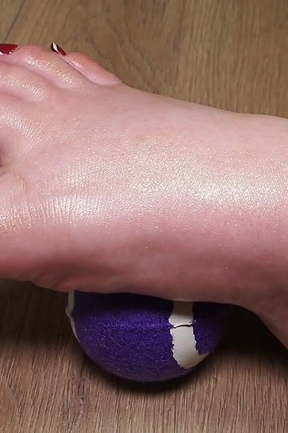Tennis Ball Under Control: Close up of BBW's Right Foot