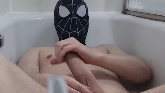 Watch hung spiderman stroke his big dick in the bath!.