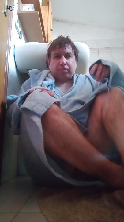Wet guy after taking a shower masturbates by peeing in the final