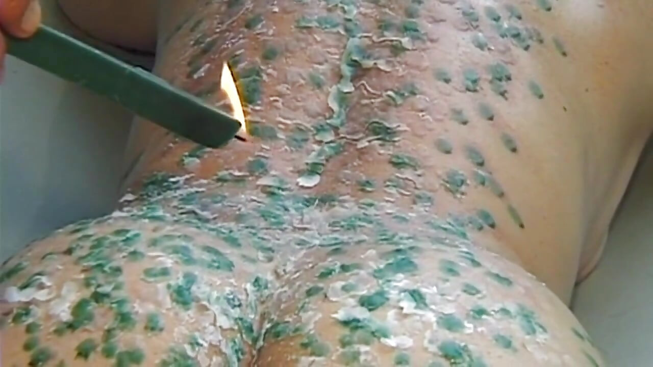 Mature MILF Enjoys Hot Wax Dripping Across Her Ass