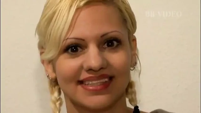 Blonde milf with her legs held 180 degrees to screw her pussy with the sex toy