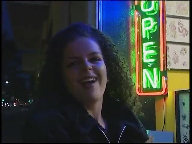 Fabulous brunette with curly hair wants a new tattoo