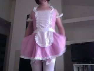 Sissy boy in pink dress bends over