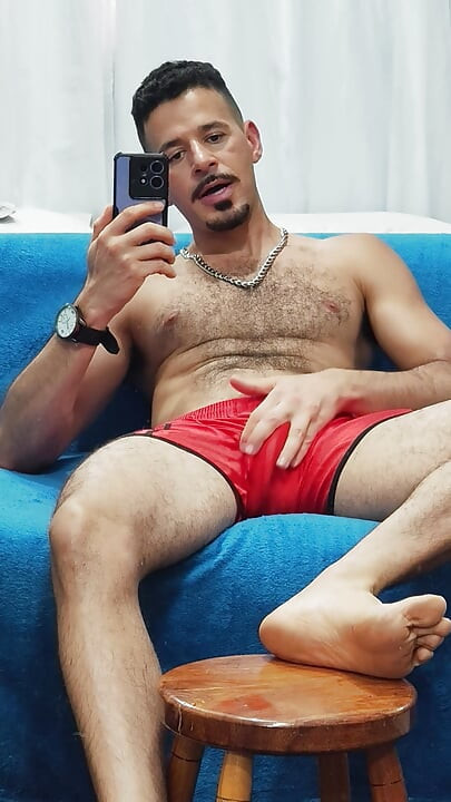 Teasing with red football shorts