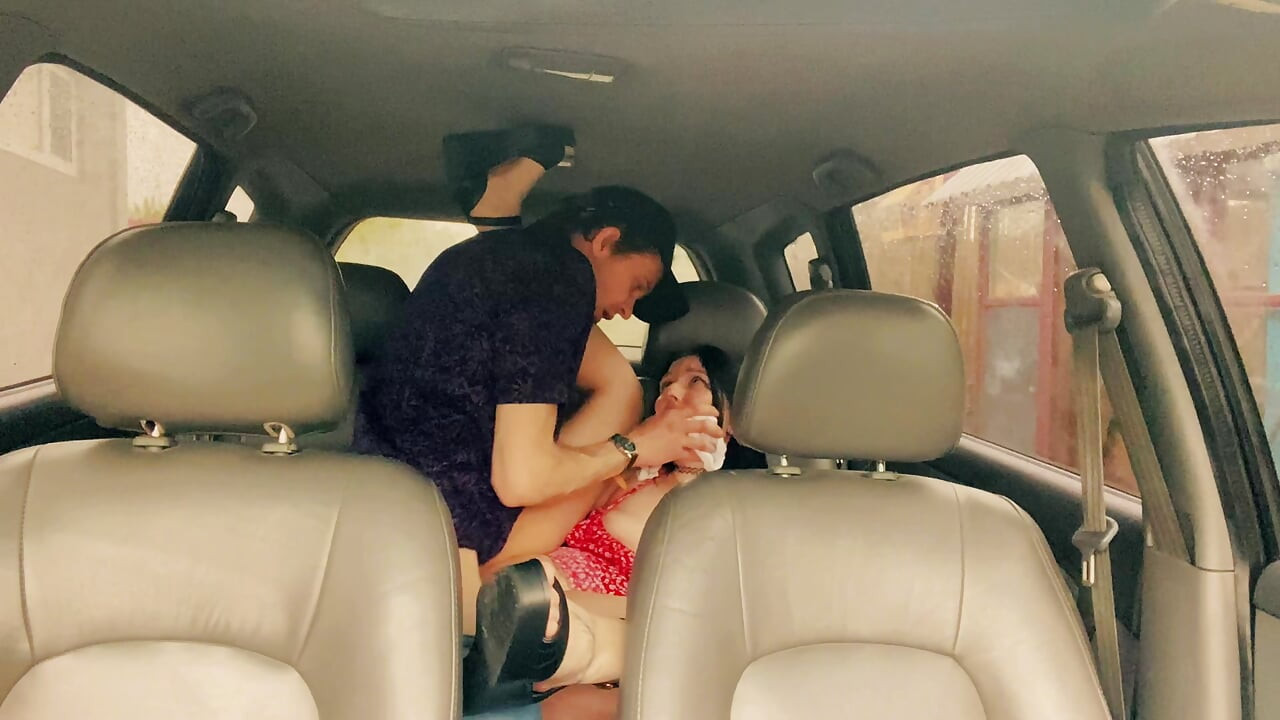Wife cheating with a taxi driver in the car outside the house