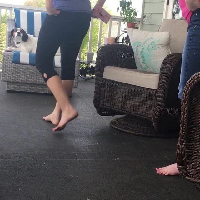 Wife and sister-in-law barefoot on the porch