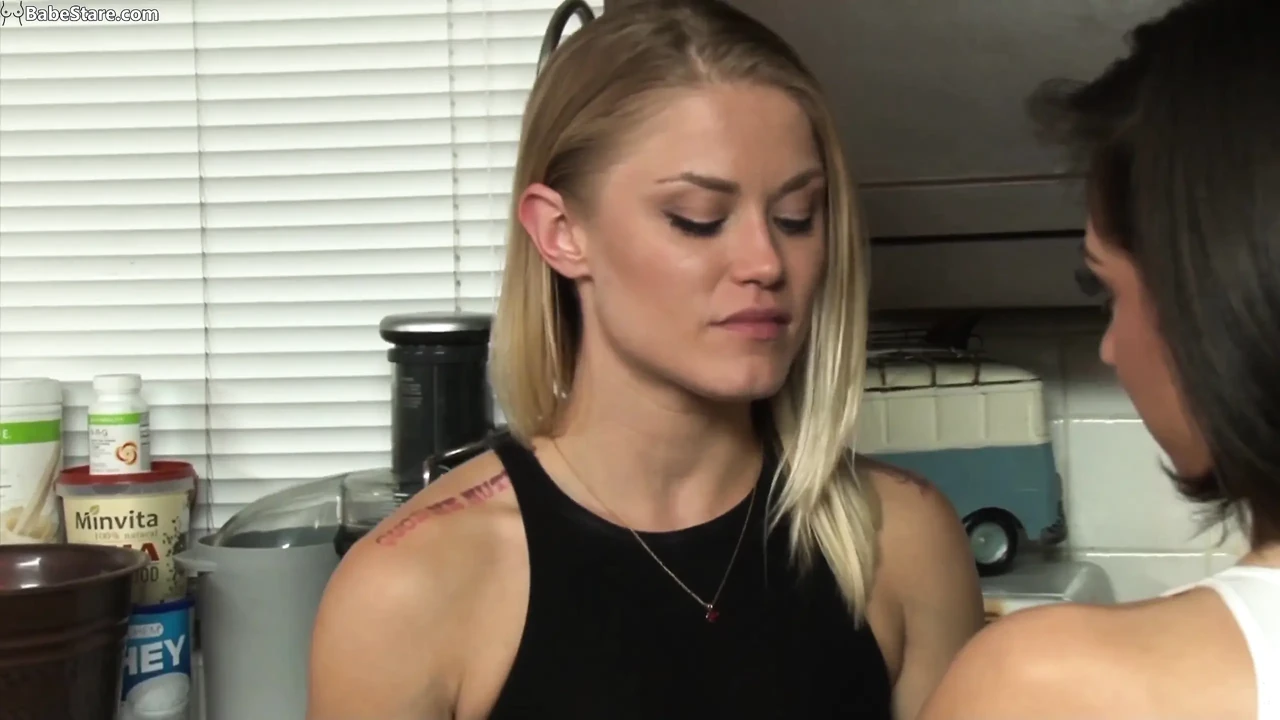 Hot blonde seduces her girlfriend in the kitchen
