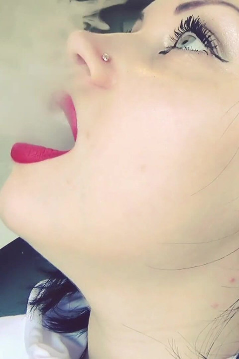 Smoke from dark red big lips