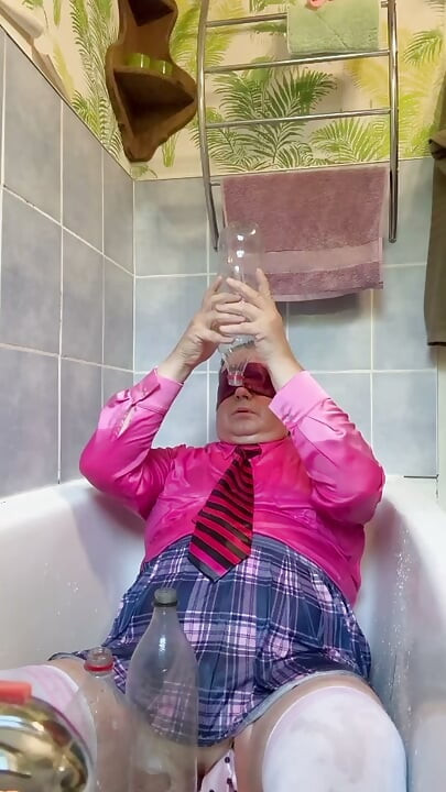 In a schoolgirl outfit to take a piss shower with bottles