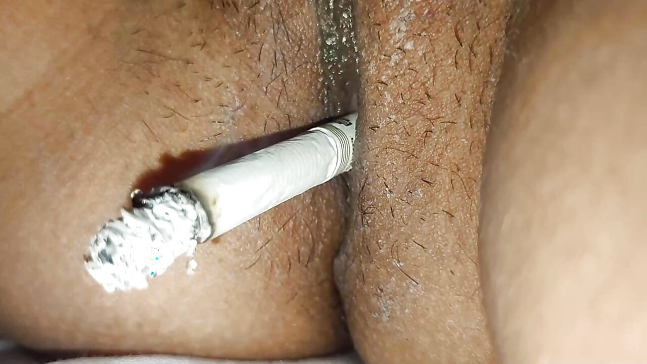 Rajasthani  Neha  Pussy of the Smokes cigarette and gets  fingers inserted in her pussy