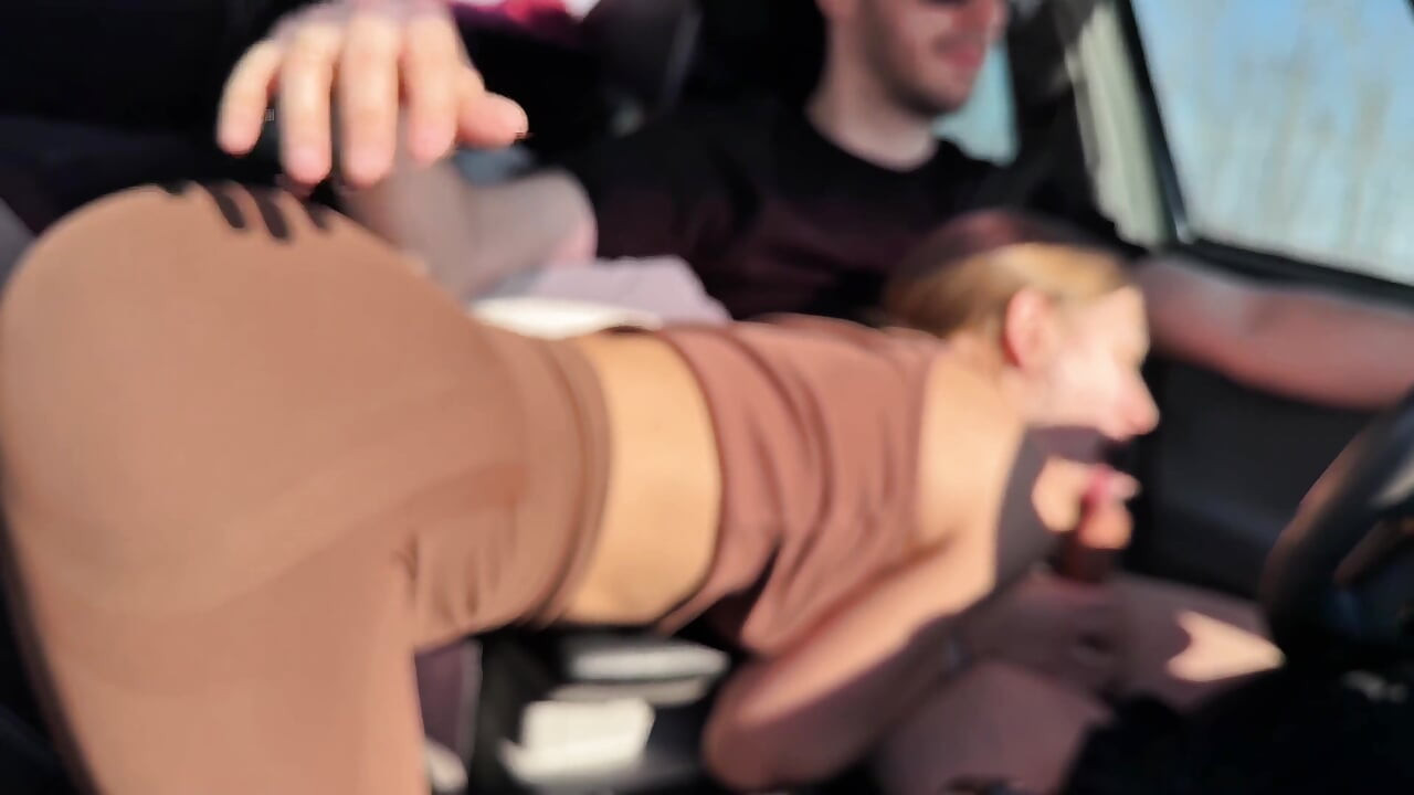 Sucking Her Driver Behind the Wheel