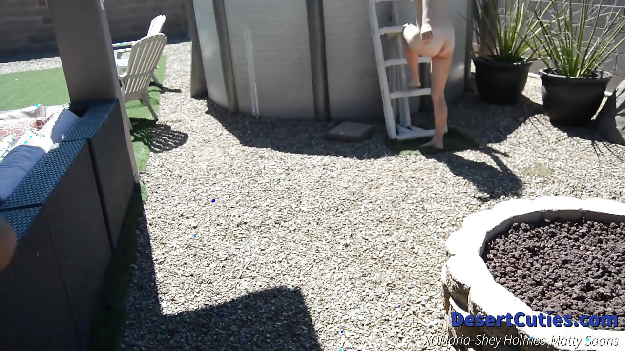 Shey Holmes and two other teens play naked cornhole